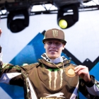 Tucker Hibbert holds up his gold medal for people to see