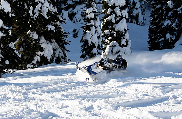 Photo of a snowmobiler tearing it up