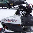 sledders gathering at a cabin