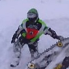 man pulling his sled out of snow